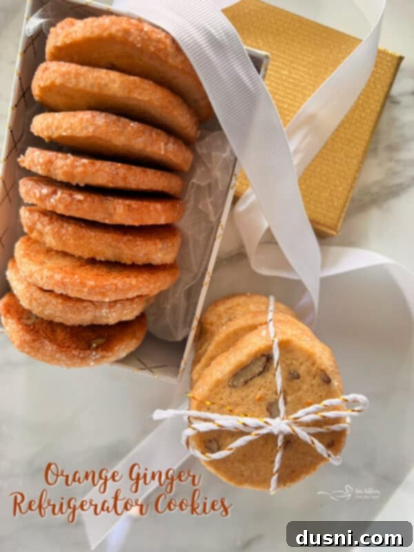 A festive display of Orange Ginger Refrigerator Cookies in a decorative box with holiday accents.