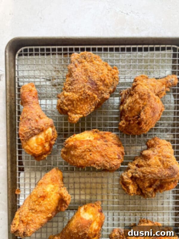Homemade KFC-Style Fried Chicken 12 Chicken frying in hot oil in a skillet