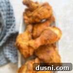 Homemade KFC-Style Fried Chicken 19 KFC copycat Fried chicken in a white serving dish.