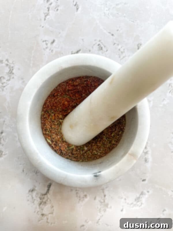 Homemade KFC-Style Fried Chicken 9 Chicken marinating in buttermilk and egg mixture