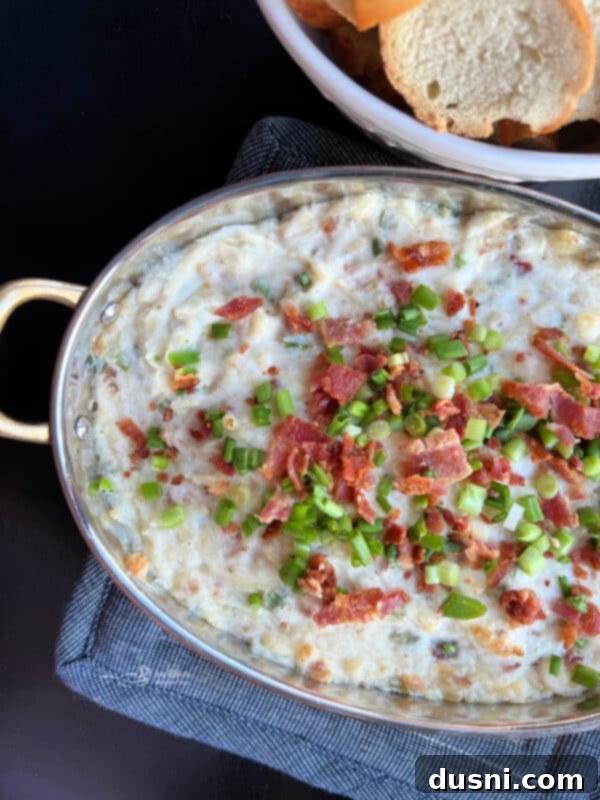 Sauerkraut, Bacon, and Swiss Dip 3 Sauerkraut, Bacon & Swiss Dip baking in a dish, showing its creamy texture