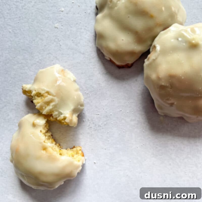 Golden Baked Banana Bites 14 Baked banana fritters stacked on a plate, ready to be pinned.