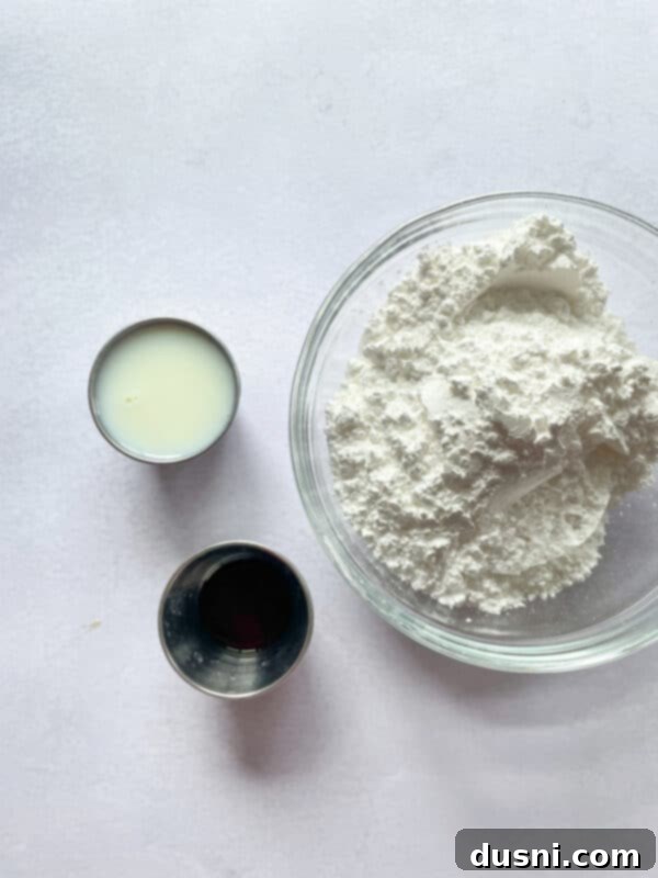 Golden Baked Banana Bites 4 Close-up of chopped bananas and grated orange zest in a bowl, ingredients for fritters.