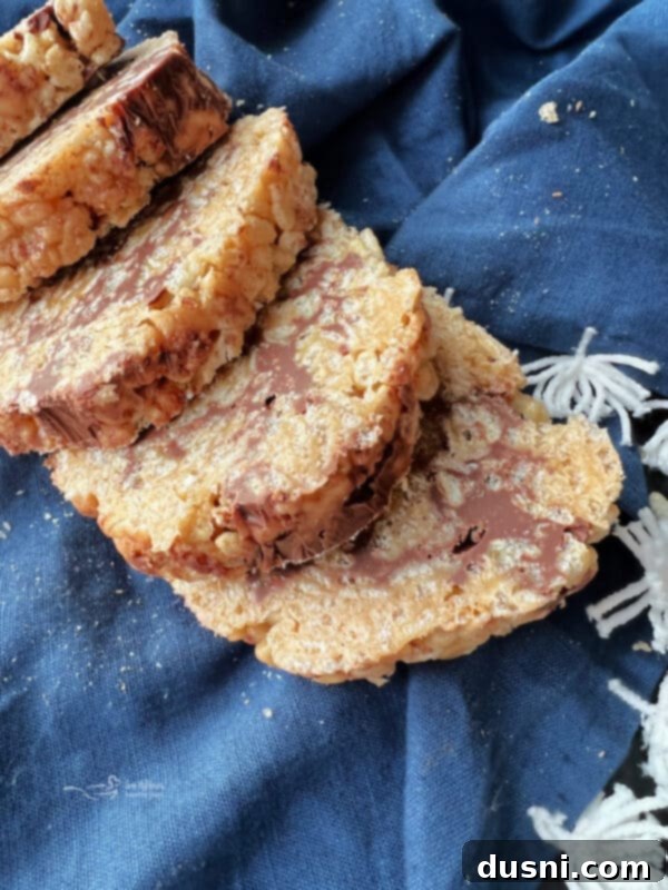Scotcheroo Swirls 3 Close-up of freshly rolled Scotcheroo Pinwheels before slicing
