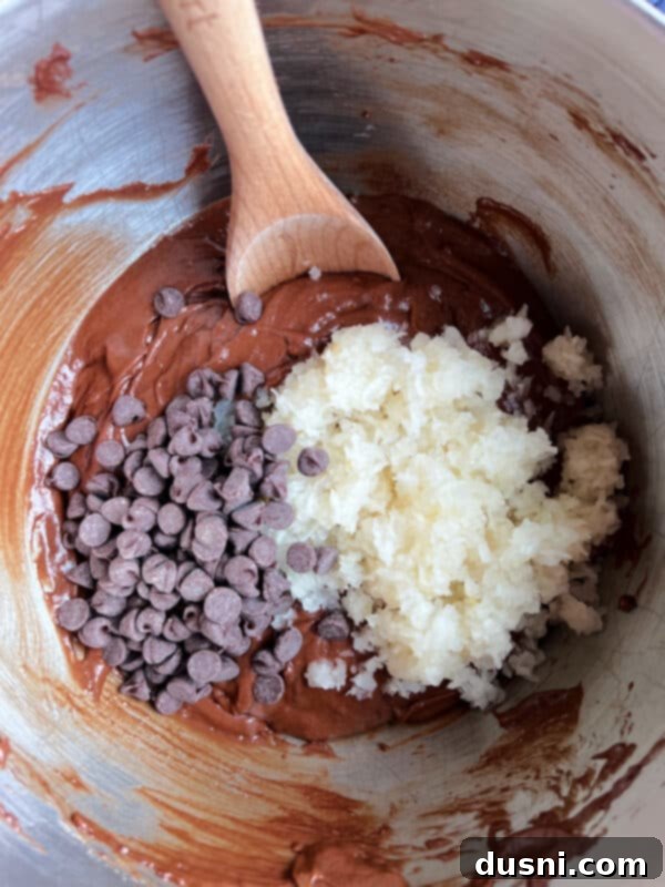 The Sauerkraut Secret Chocolate Pound Cake 11 Chocolate sauerkraut cake batter with chopped sauerkraut and chocolate chips being folded in