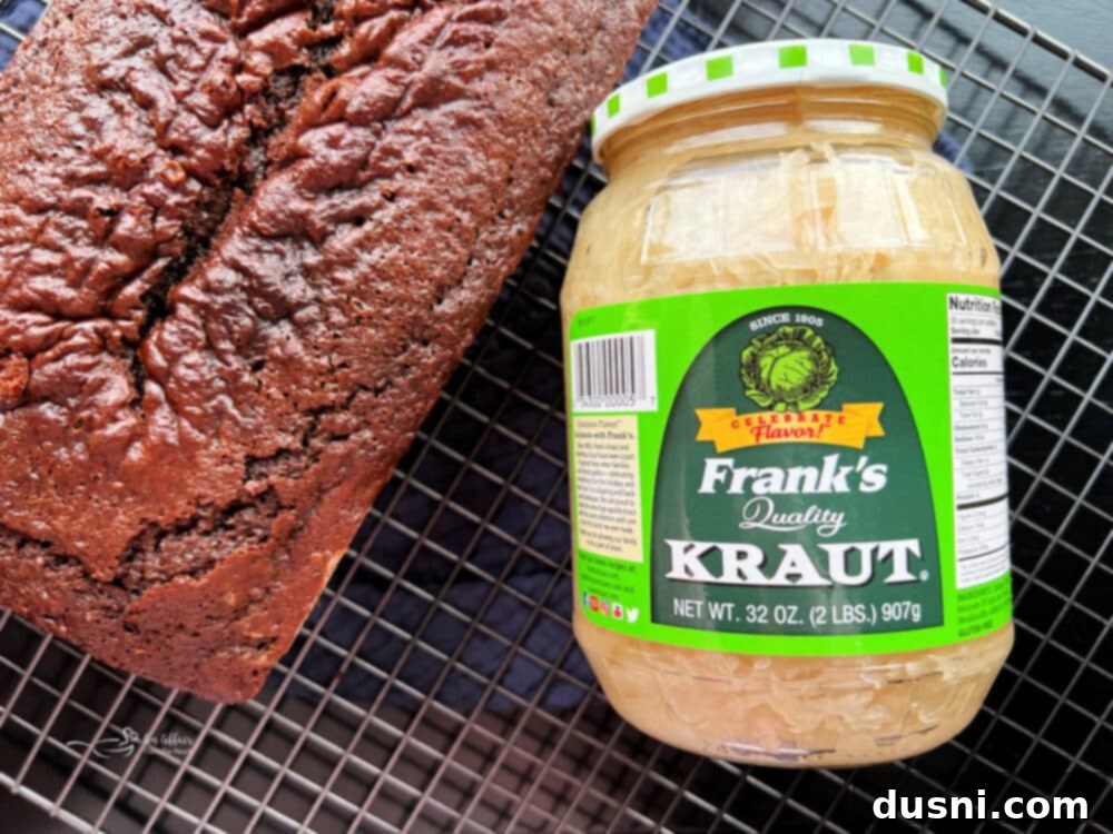 The Sauerkraut Secret Chocolate Pound Cake 4 Chocolate Sauerkraut Pound Cake on a rustic wooden board, ready to be sliced
