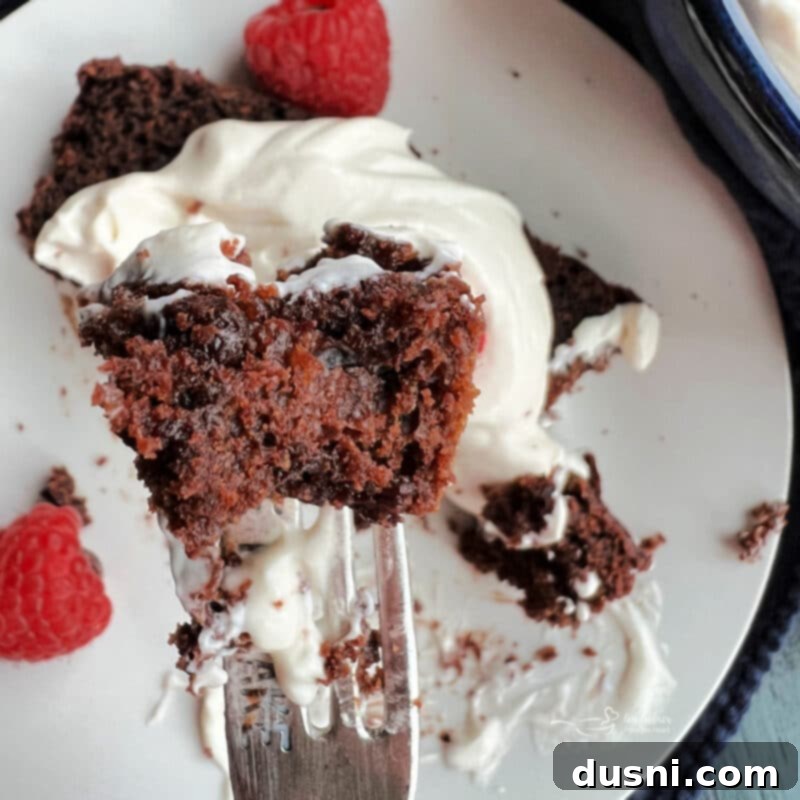 The Sauerkraut Secret Chocolate Pound Cake 5 Delicious slice of Chocolate Sauerkraut Pound Cake on a plate with fresh berries