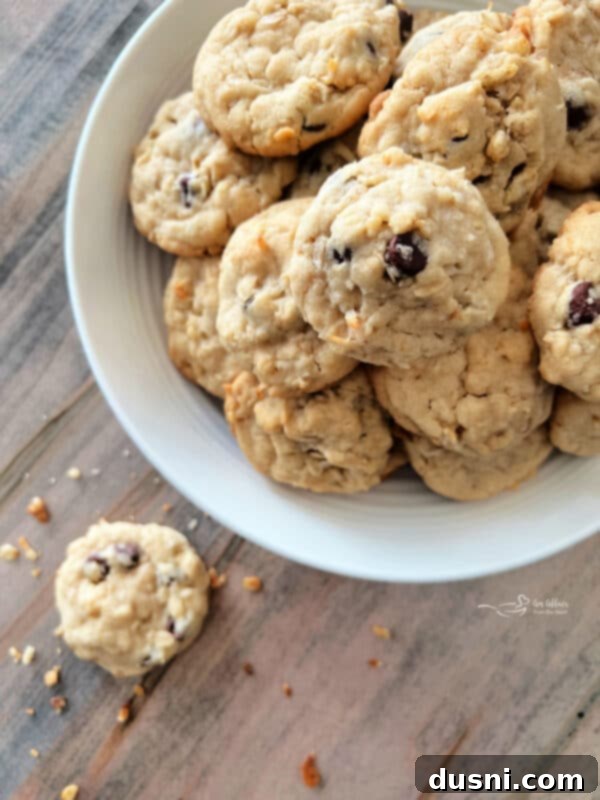 Mom's Homemade Delights 2 Yum Yum Cookies stacked in a white bowl with a vintage spoon.