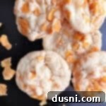 Cornflake crispy cookies close up on a dark background.