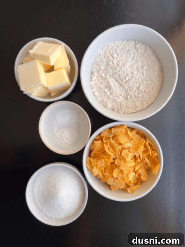 A plate of freshly baked Cornflake Crispy Cookies, ready to be enjoyed with a glass of milk.