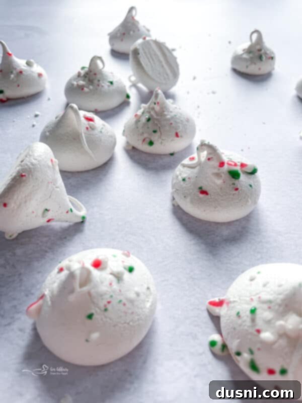 Peppermint meringues on a decorated festive plate.