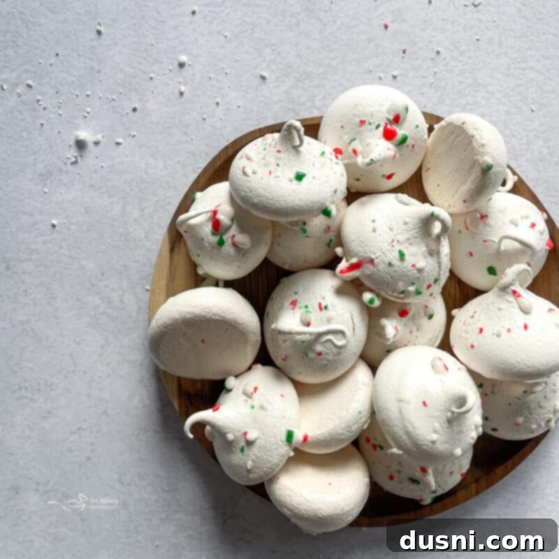 A large batch of peppermint meringues arranged for a festive occasion.