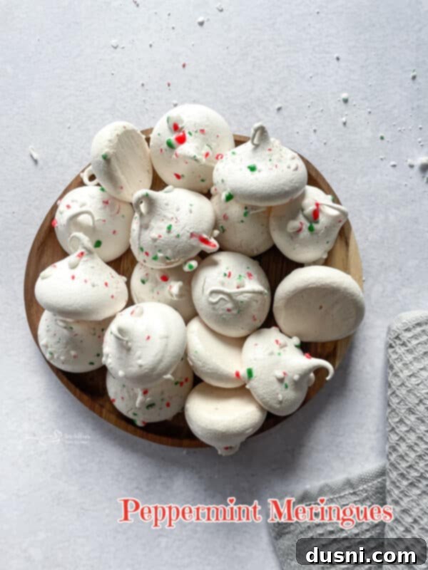 A festive image of Peppermint Meringues in a bowl.
