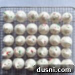 Close up of peppermint Meringues lined up on a cooling rack.