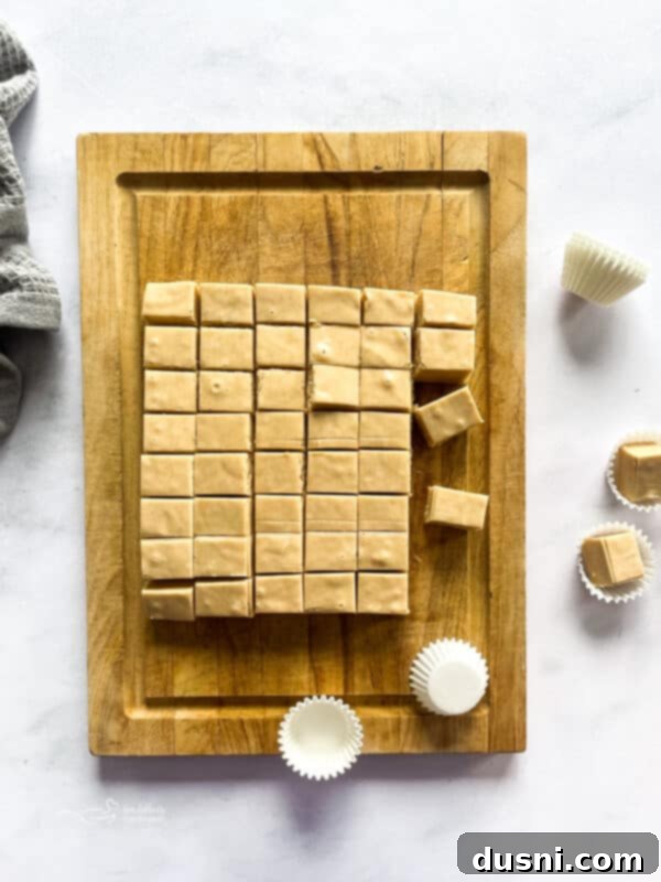 Decadent Peanut Butter Fudge 11 A cutting board with fresh peanut butter fudge.
