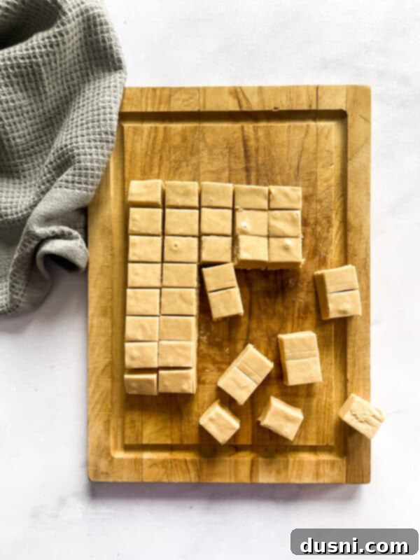 Decadent Peanut Butter Fudge 12 Peanut Butter Fudge squares with a decorative bowl.