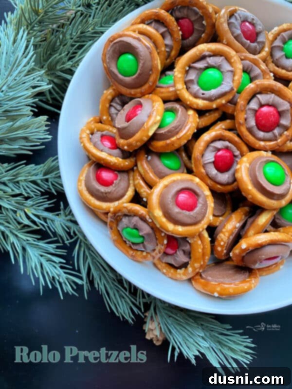 A close-up of Rolo Pretzel Bites with a Christmas background