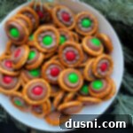 Close up of Rolo pretzels stacked in a white serving bowl.