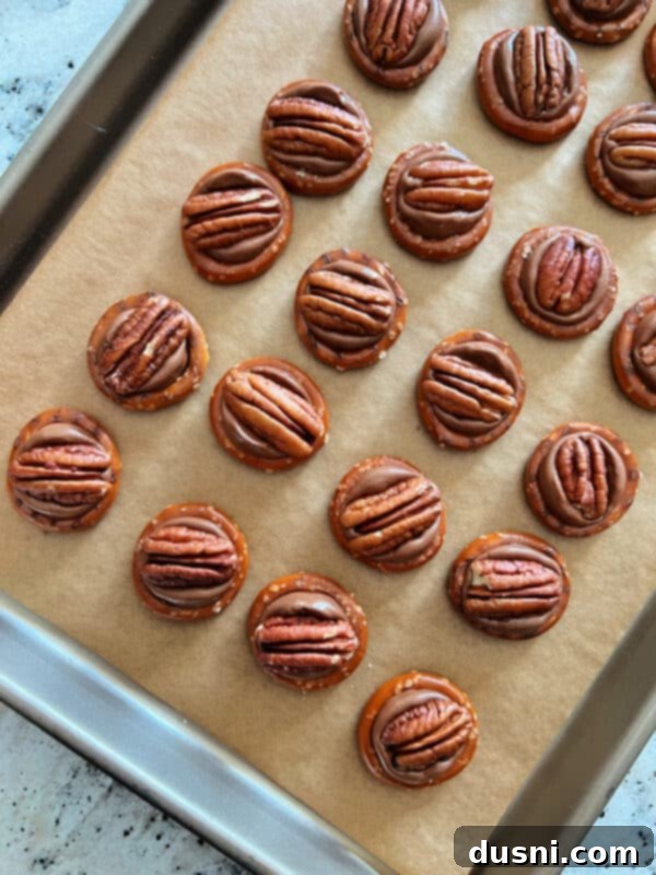 Rolo Pretzels baking on a sheet pan