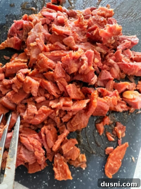Instant Pot Grandmas Comforting Ham and Bean Soup 13 Shredded ham on a cutting board, removed from the bone