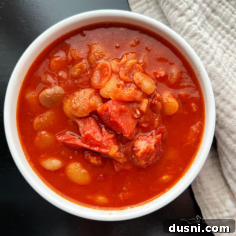 Instant Pot Grandmas Comforting Ham and Bean Soup 16 Instant Pot Ham and Bean Soup in a white bowl, ready to serve