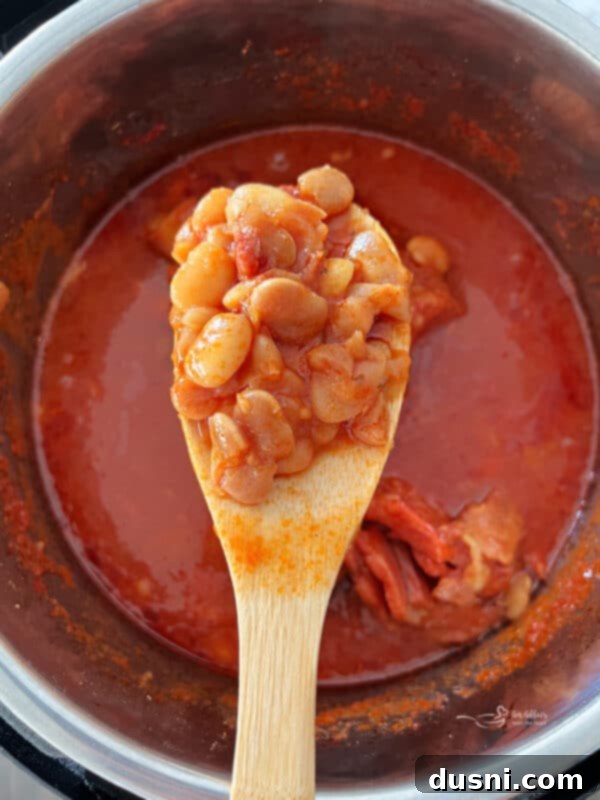 Instant Pot Grandmas Comforting Ham and Bean Soup 8 Instant Pot Ham and Bean Soup served on a wooden spoon