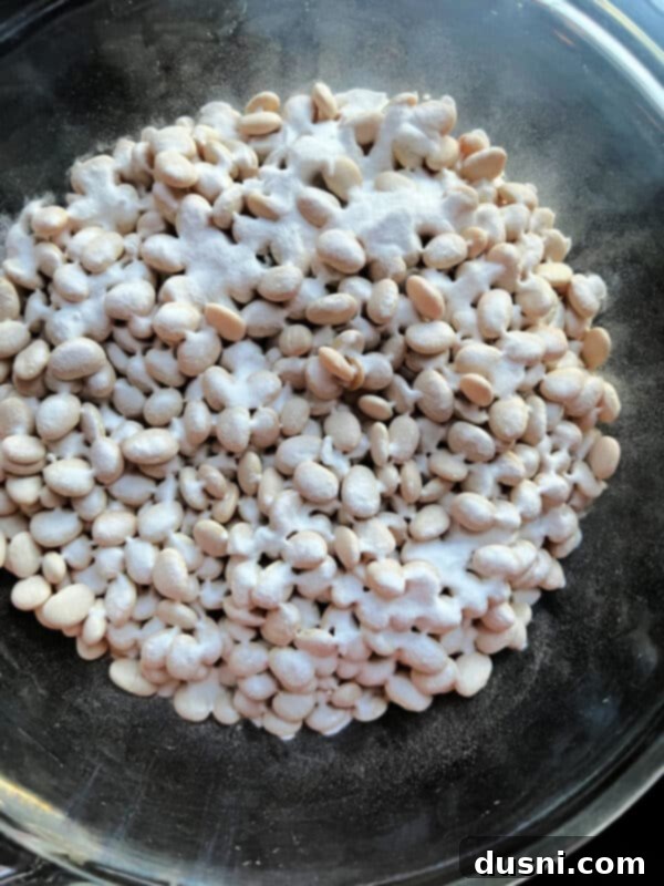 Instant Pot Grandmas Comforting Ham and Bean Soup 9 Dried lima beans with baking powder on a baking sheet