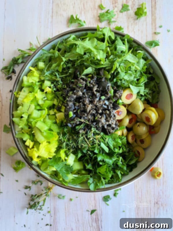 Step 1: Whisking together the lemon herb dressing ingredients.