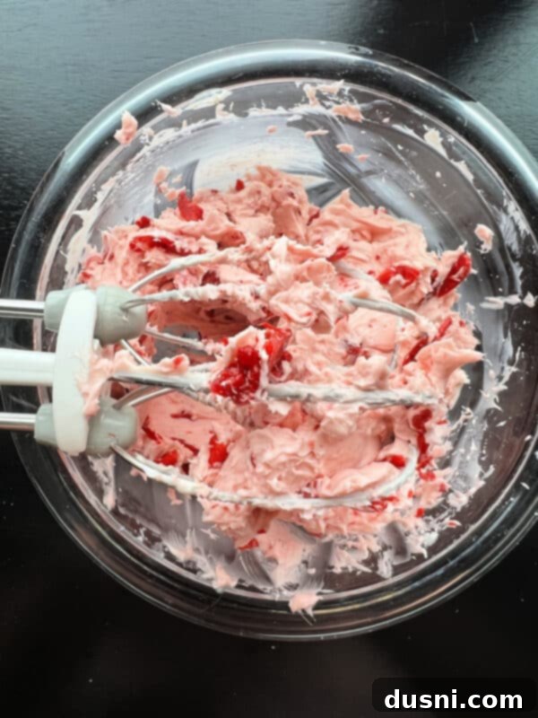 Cherry Cloud Spread 9 Finished whipped cherry butter in a mixing bowl, ready to be transferred.