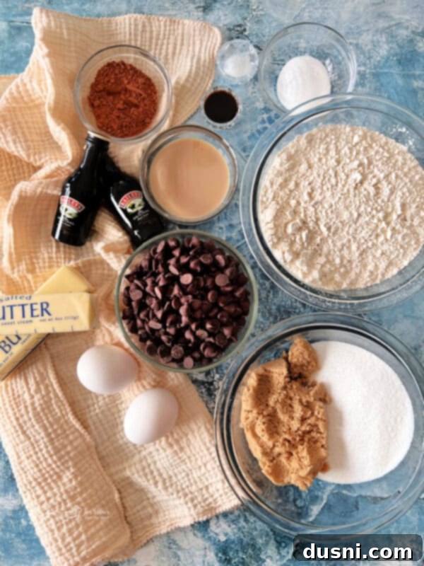 A single, perfectly baked Bailey's Chocolate Chip Cookie on a white background, highlighting its rich color and texture.