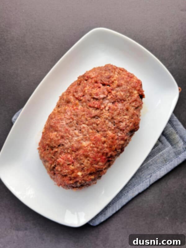 Deli-Style Meatloaf 13 Swiss cheese sauce being made in a saucepan