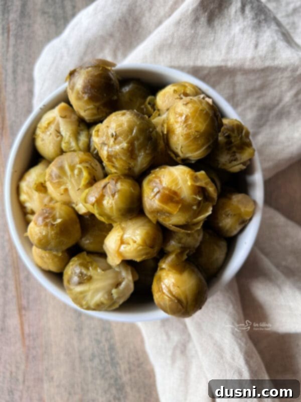 Jar of Paisley Farm Dilled Brussels Sprouts on a wooden surface
