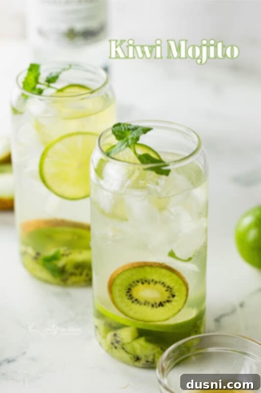 Vibrant Kiwi Mojito 13 Two Kiwi Mojitos in tall glasses with fresh kiwi and mint garnishes.