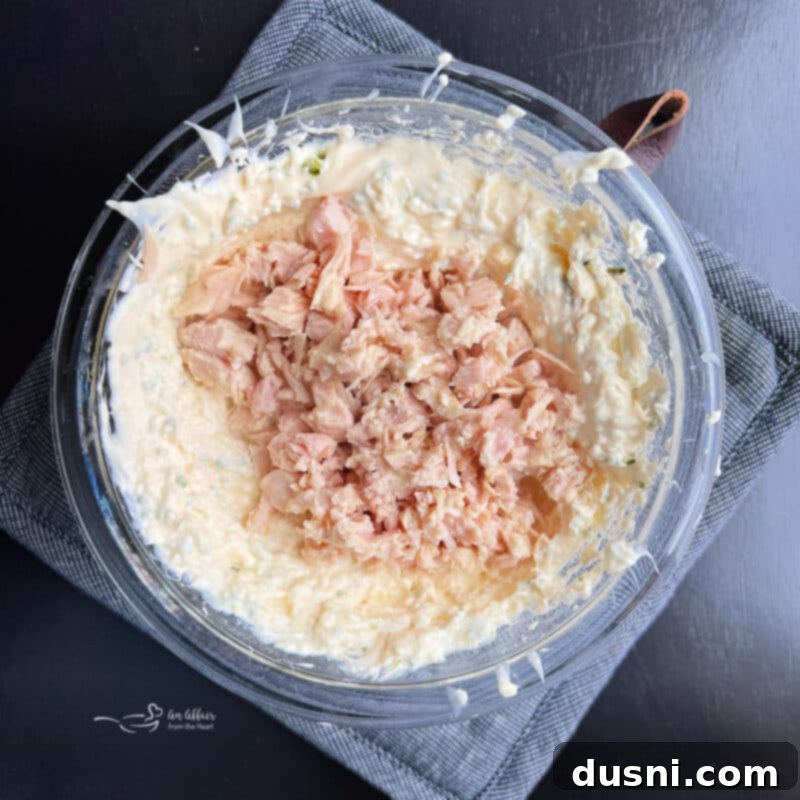 Golden Chicken Cracker Dip 6 Step-by-step: Mixing chicken into dip base