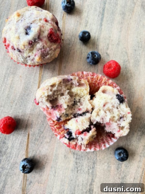 Inside of Muffins showing the fluffy texture and berries