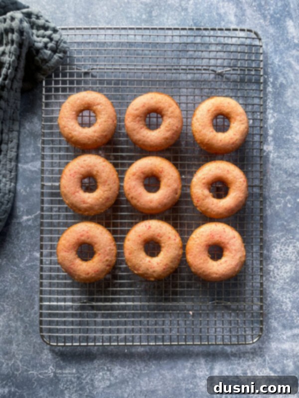 Sun-Kissed Strawberry Lemonade Donuts 7 Strawberry donut batter piped into a donut baking pan