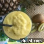 Tropical Kiwi Pineapple Bliss 2 Overhead of smoothie with text "pineapple kiwi smoothie"