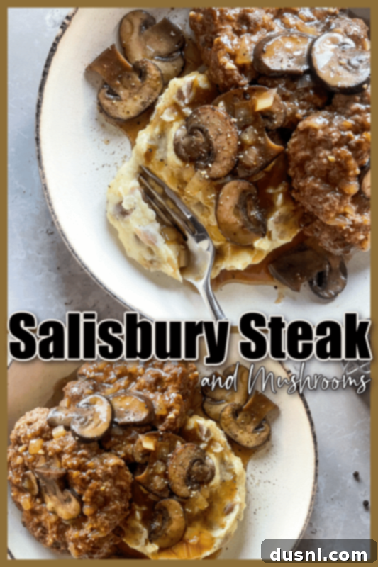 Classic Salisbury Steak with Savory Mushroom Gravy 15 Overhead shot of Salisbury steak with mushrooms and mashed potatoes on a white plate