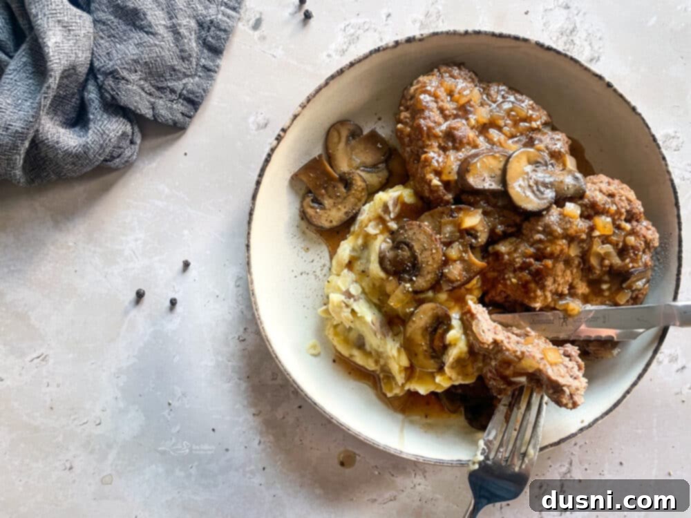 Classic Salisbury Steak with Savory Mushroom Gravy 6 Skillet with sautéed mushrooms for Salisbury steak gravy