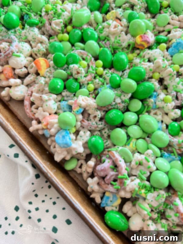 Pot of Gold Snack Blend 15 Adding M&M's and sprinkles to the snack mix.