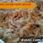 Hashbrown casserole in a white dish with text "cracker barrel hash brown casserole with bacon"