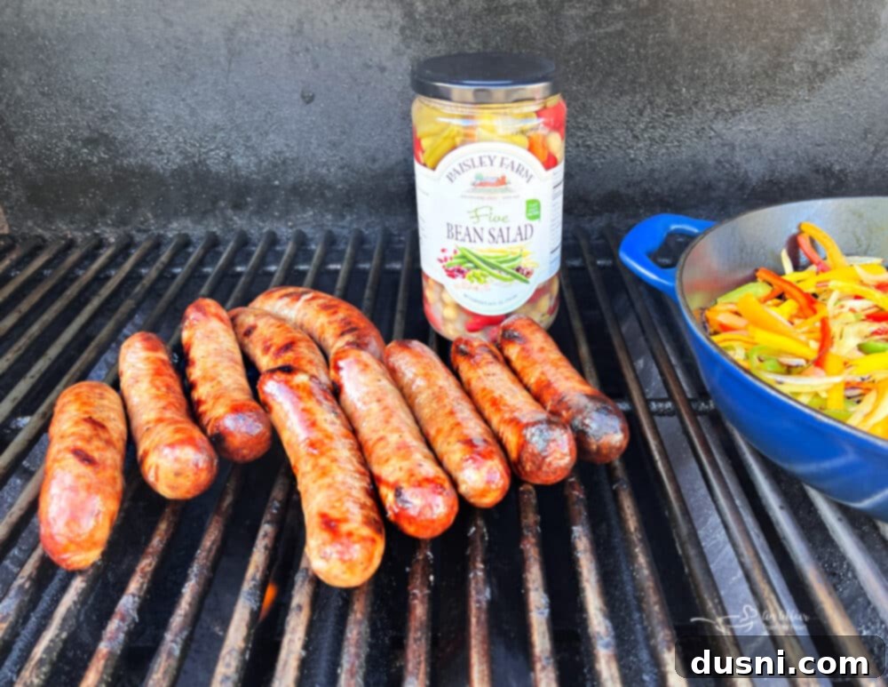 Grilled Italian Sausages cooking on a grill