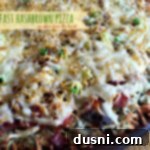 Close up picture with text "breakfast hashbrown pizza"