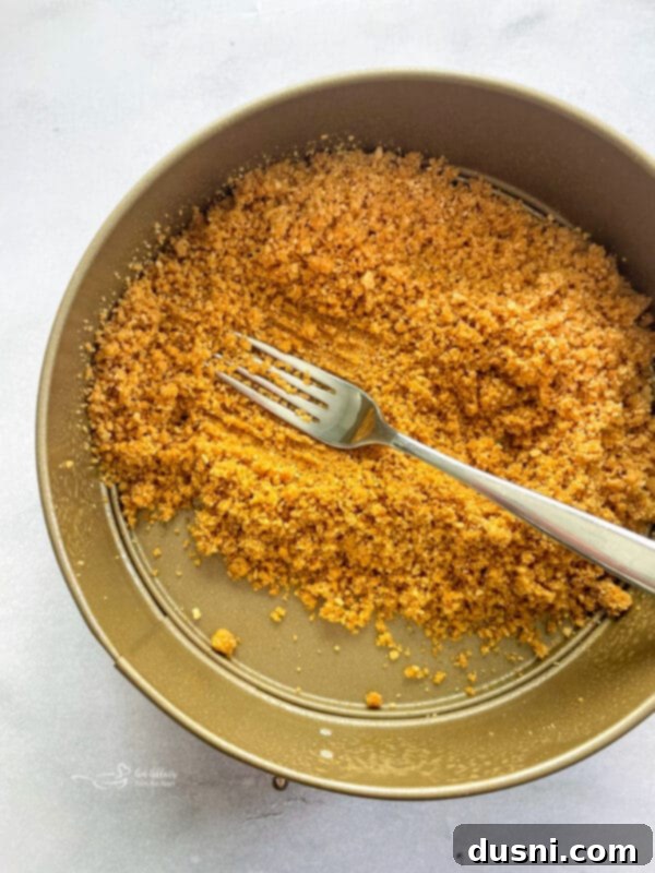 Dreamy Marshmallow Cloud Cheesecake 9 Animal Cracker Crust pressed into a springform pan, ready for the filling.