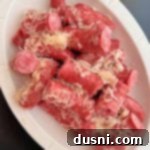 Savory Smoked Kielbasa and Sauerkraut 13 Polish Sausage & Sauerkraut in a white serving dish