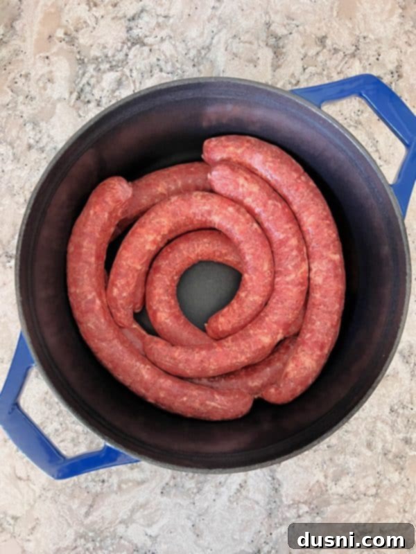 Savory Smoked Kielbasa and Sauerkraut 4 Laying smoked Polish sausage in a Dutch oven