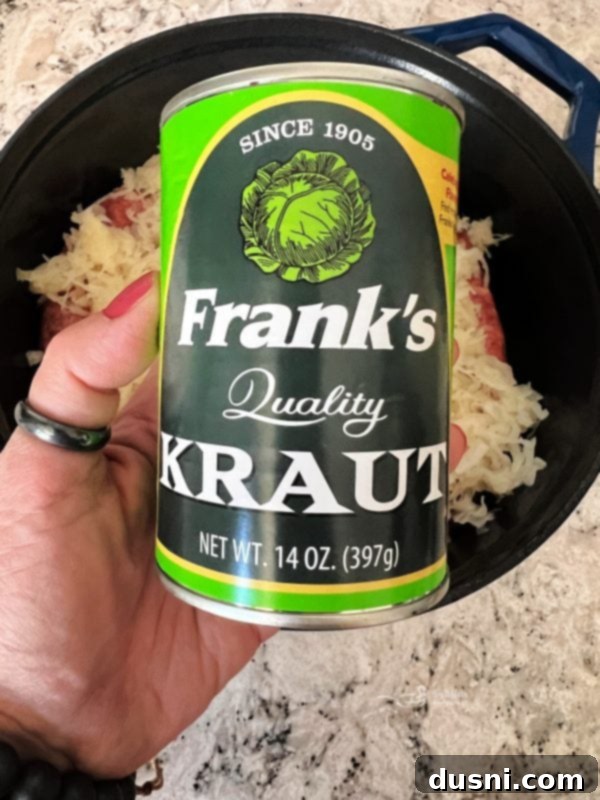 Savory Smoked Kielbasa and Sauerkraut 5 Covering sausage with sauerkraut and water