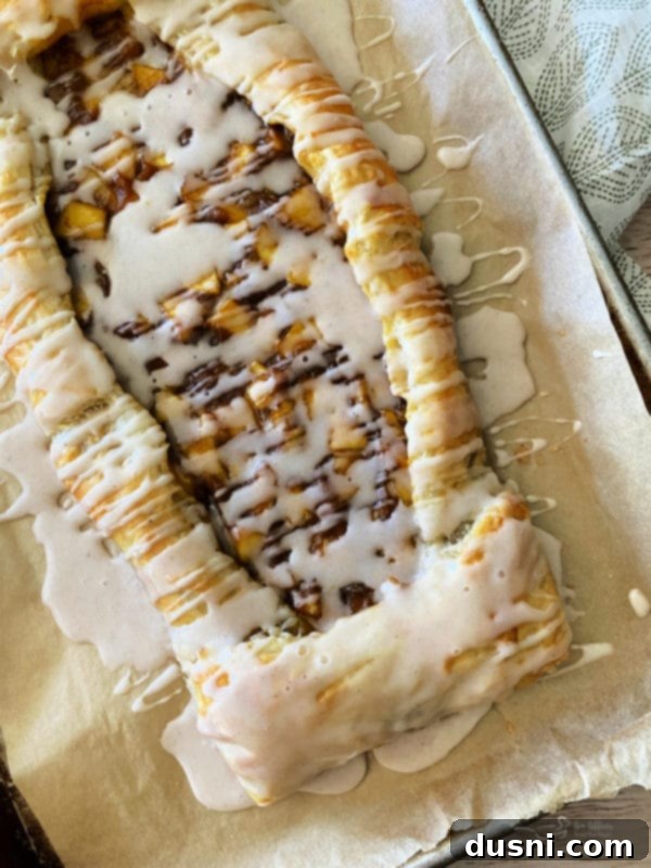 one baked apple pumpkin strudel with icing