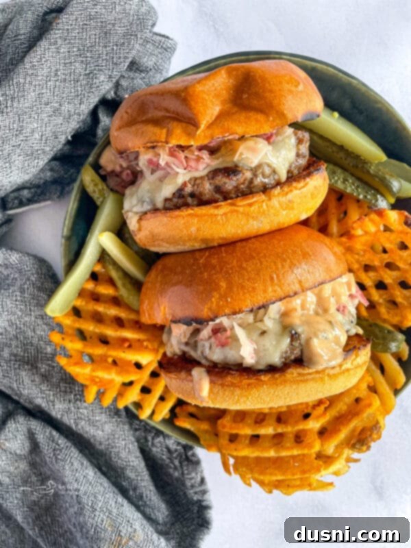 Reuben Burgers on Plate with Sweet Potato Waffle Fries