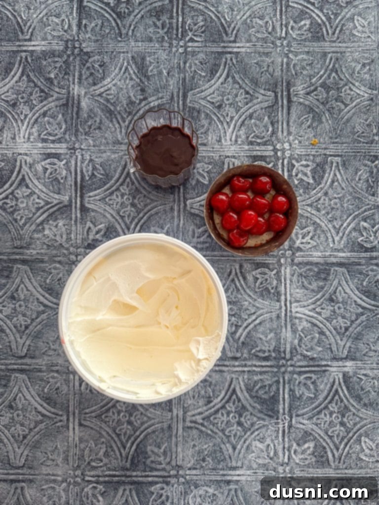 Fried Ice Cream Pie 7 Garnish ingredients for fried ice cream pie: maraschino cherries, chocolate syrup, Redi-Whip